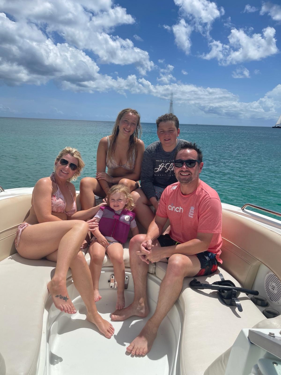 James and family on a boat in Barbados