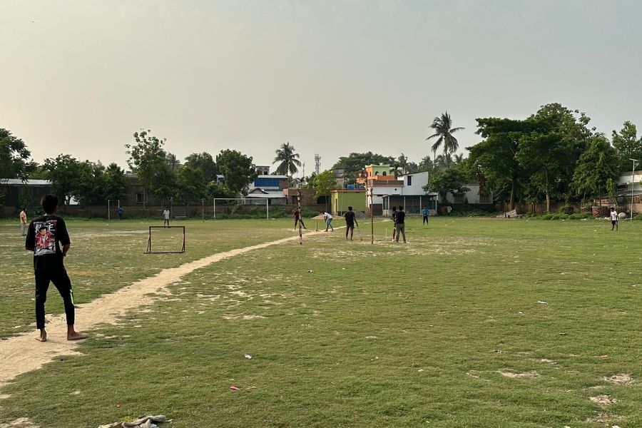 Local game of cricket in Kalna, India